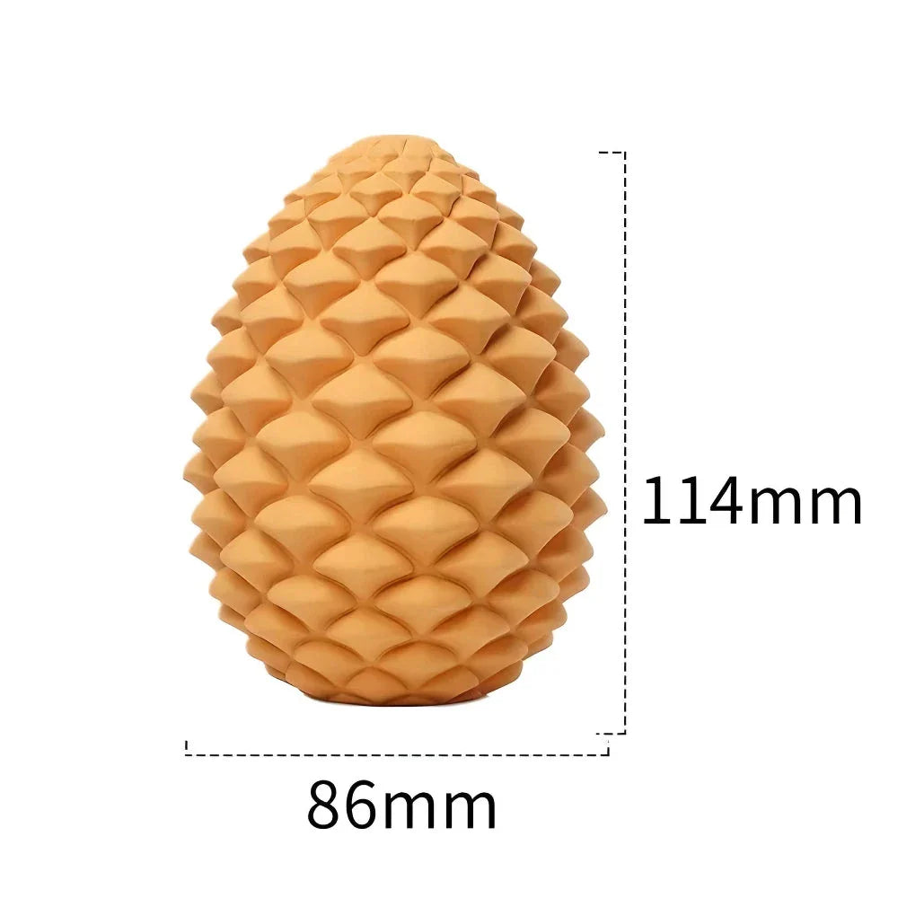 Sustainable pineapple-inspired dog chew toy with textured surface for dental cleaning and treat-dispensing design for mental stimulation