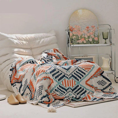 Cozy boho geometric cotton blanket in multicolor design, perfect for adding style and comfort to Kiwi homes and outdoor spaces