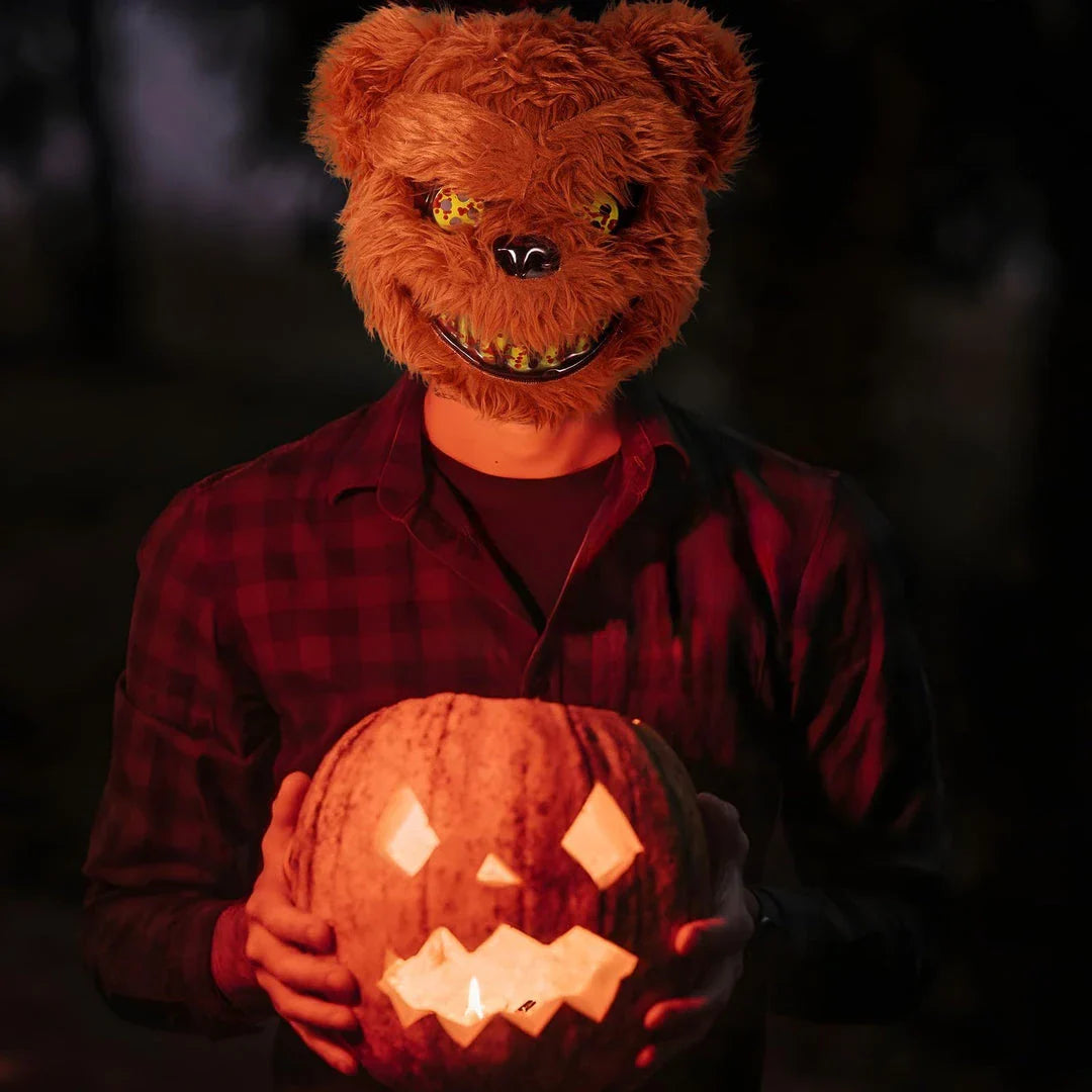 A creepy and realistic plush bunny mask with long pink ears, a bloody mouth, and glowing green eyes - perfect for Halloween and costume parties.