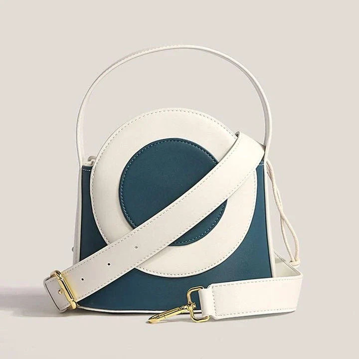 Stylish Kiwi vegan leather bucket bag with a unique colour block design, featuring adjustable straps and interior pockets