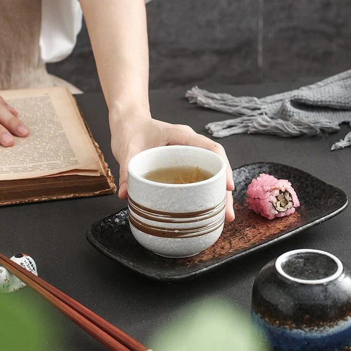 Eco-friendly and durable ceramic tea mug with minimalist design, featuring a 200ml capacity and comfortable grip