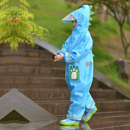 A child wearing a vibrant yellow waterproof raincoat jumpsuit, perfect for playing outdoors in the rain.