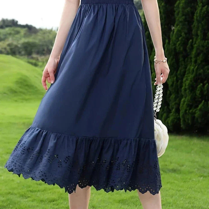 Elegant blue high-waisted A-line summer skirt with intricate lace patchwork details