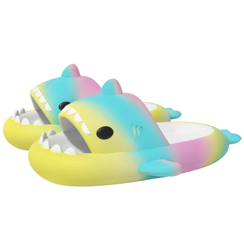 Gradient rainbow shark-patterned slippers with a comfortable EVA sole and durable PVC upper, available in a range of vibrant colours