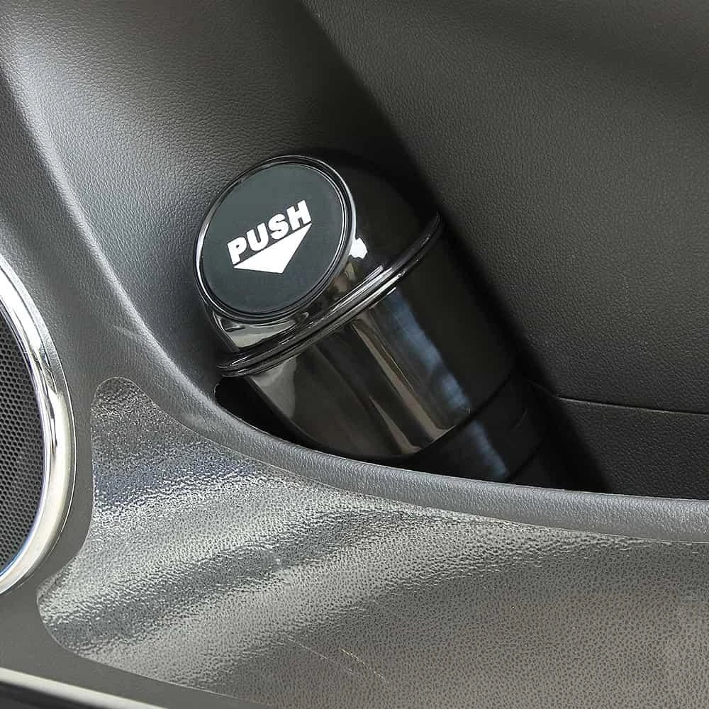 Compact in-car rubbish bin made of durable ABS plastic, designed to fit in car cup holders and keep vehicles clean and organised