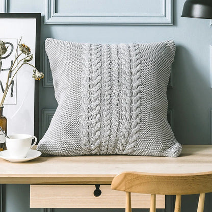 Elegant grey knitted decorative pillow case with intricate jacquard pattern and embroidered stripes