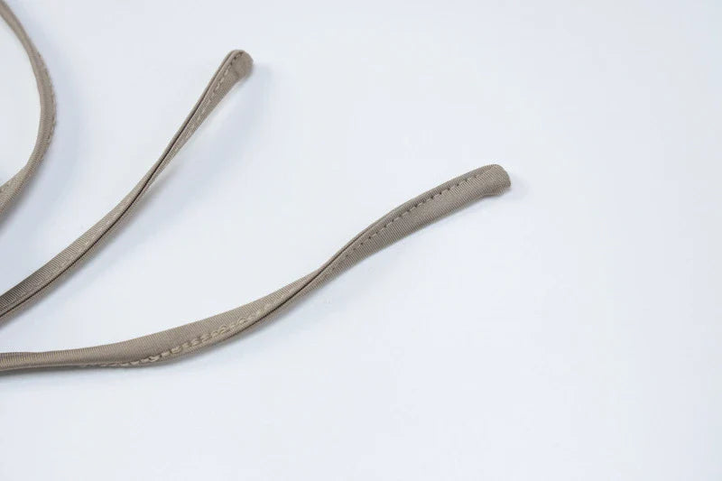 A stylish one-shoulder top and drawstring skirt set made from premium milk silk fabric, perfect for elevating your casual wardrobe.