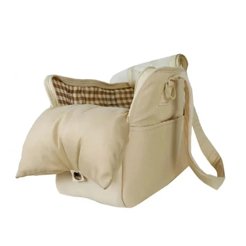 A stylish and practical cotton shoulder bag carrier for small dogs, with a hard board base and cozy interior for comfort and security during adventures.