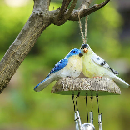 Charming wind chime featuring resin birds in vibrant Kiwi colours, swaying gently in the breeze and emitting a melodious sound.