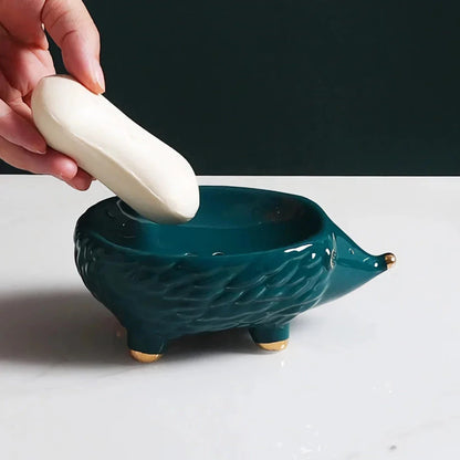 Charming hedgehog-shaped ceramic soap dish in green and white colours for bathroom decor