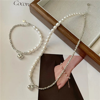 Elegant heart-shaped pearl and sterling silver necklace, a timeless accessory for the modern New Zealand style.