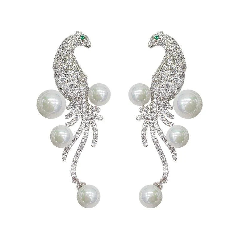 Elegant bird-themed pearl and tassel stud earrings in a versatile design