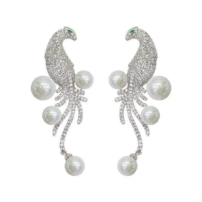 Elegant bird-themed pearl and tassel stud earrings in a versatile design