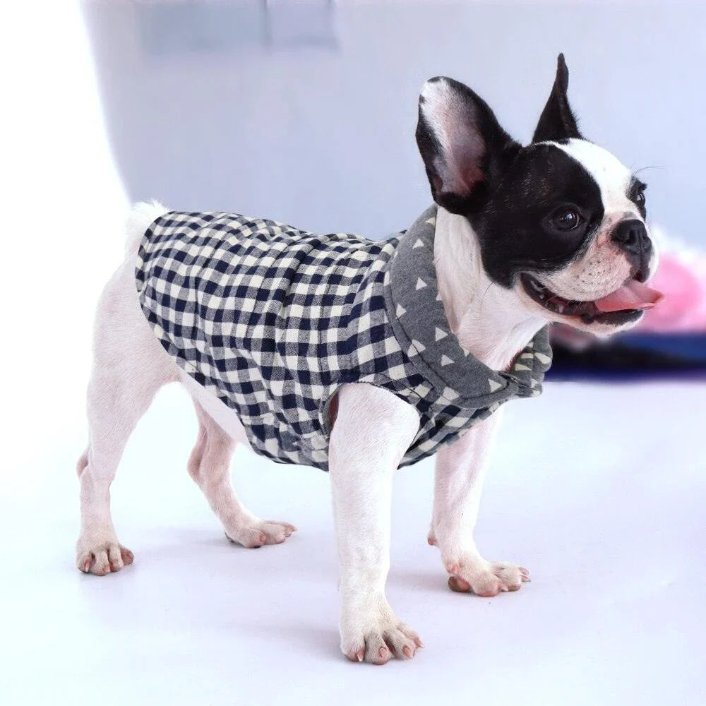 Stylish plaid pet vest for dogs in a variety of sizes, featuring a sleeveless design and durable polyester material.