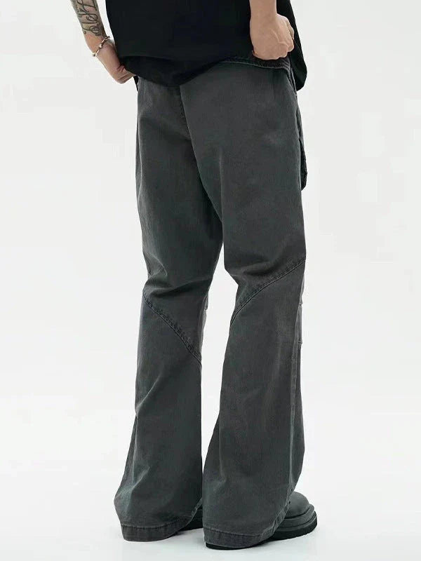 Black washed micro-flared trousers with pleated design and large pockets, perfect for the modern Kiwi lifestyle