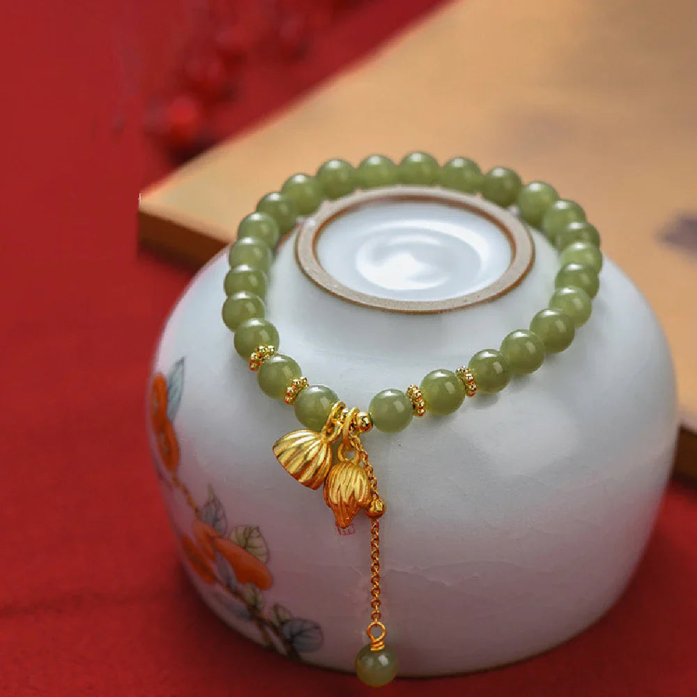 Handcrafted Hotian jade bracelet with a vintage-inspired floral design, a timeless Kiwi treasure