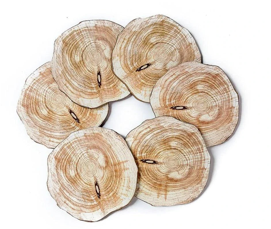 Set of 6 natural timber coasters in various grain patterns, protecting a mug on a wooden surface