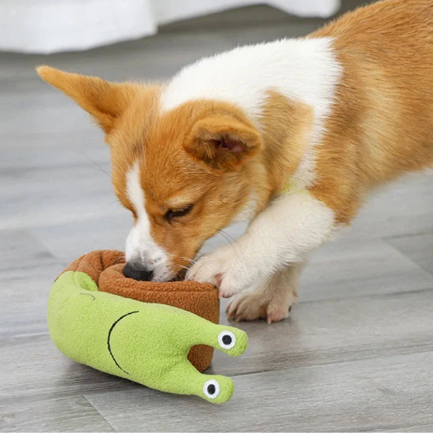 Soft, plush snail-shaped snuffle mat toy for dogs, with multiple treat-hiding pockets and a built-in sound generator for added engagement and mental stimulation.