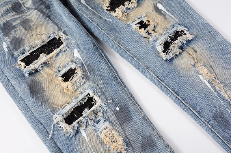 Vintage-inspired jeans with rhinestone and ink splash detailing, perfect for the modern Kiwi lifestyle