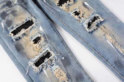 Vintage-inspired jeans with rhinestone and ink splash detailing, perfect for the modern Kiwi lifestyle