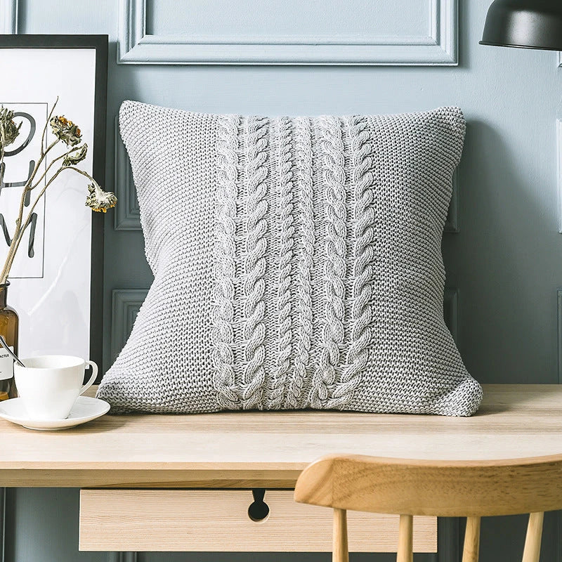 Elegant grey knitted decorative pillow case with intricate jacquard pattern and embroidered stripes