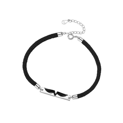 Sterling silver couple's bracelet with elegant angel wing design, adjustable size for both men and women