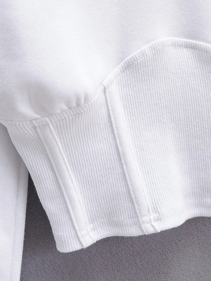 A slim-fit hooded jumper in white with a distinctive navel accent, a must-have Kiwi streetwear style.