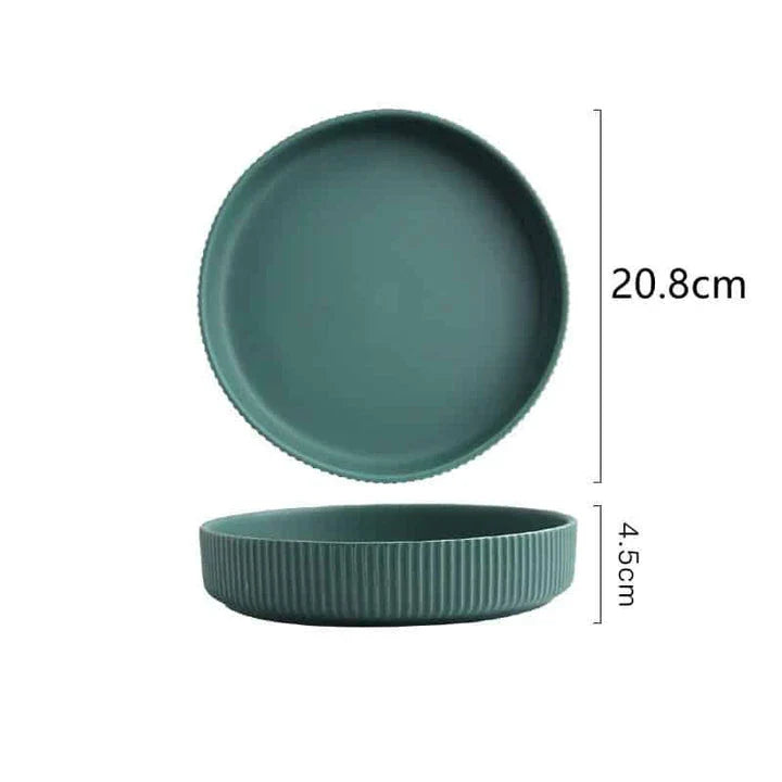 Stylish assorted candy-colored ribbed ceramic tableware set including plates and bowls, made in New Zealand with eco-friendly materials