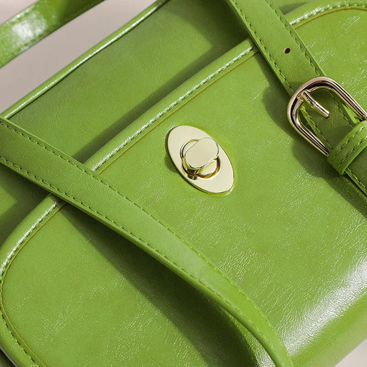 Stylish vintage-inspired flap shoulder bag with durable PVC construction and secure button closure, perfect for Kiwi fashion enthusiasts