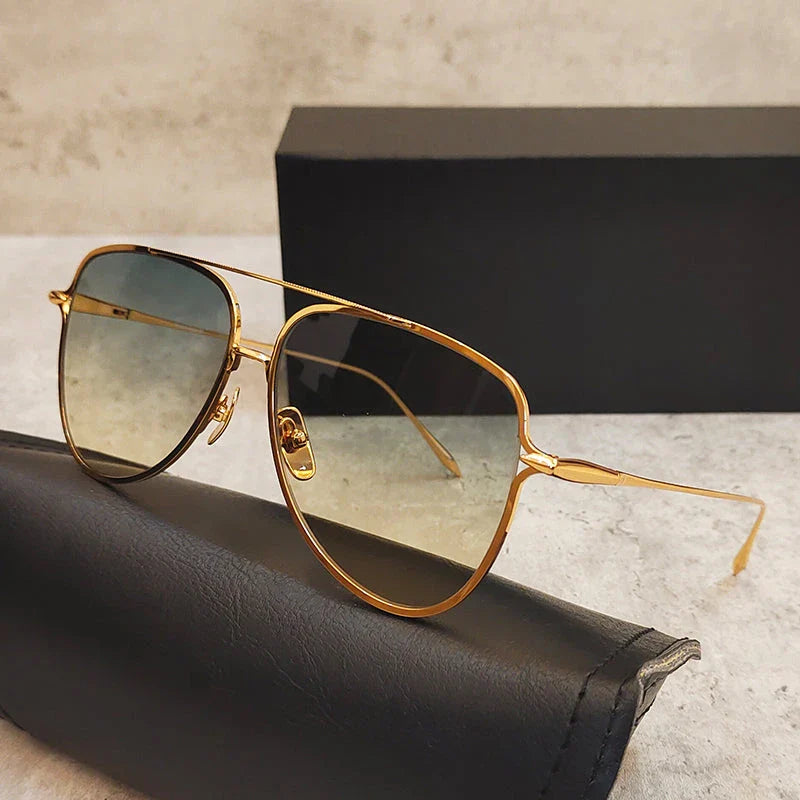 Premium pure titanium pilot sunglasses with a luxurious gold finish, offering superior UV protection and timeless vintage-inspired design.