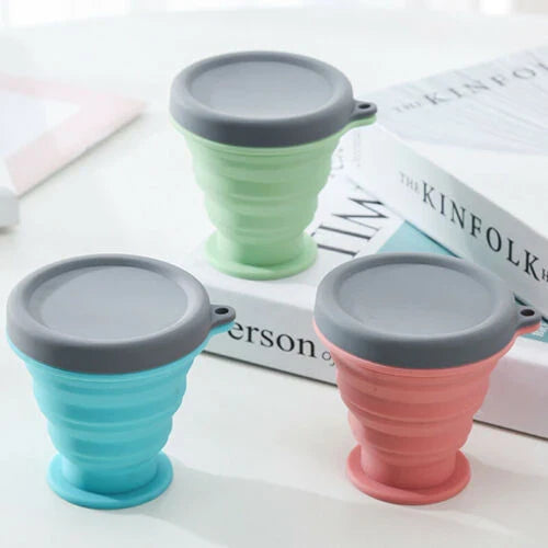 Compact, collapsible silicone cup in various colors, perfect for Kiwi travelers and adventurers