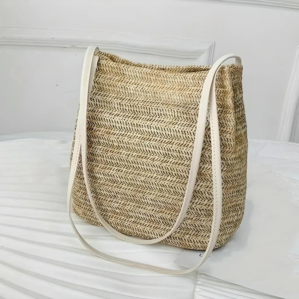 Bohemian straw woven shoulder bag in beige color, featuring a secure hasp closure and a lightweight, durable design for summer adventures.