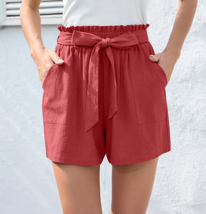 Stylish high-waisted ruffle bow shorts in black, perfect for Kiwi summer beach and casual wear