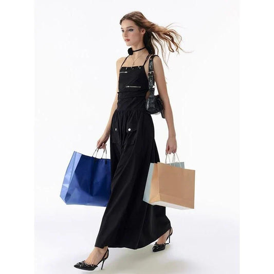 Elegant black backless maxi dress with pockets, perfect for formal events or casual outings.