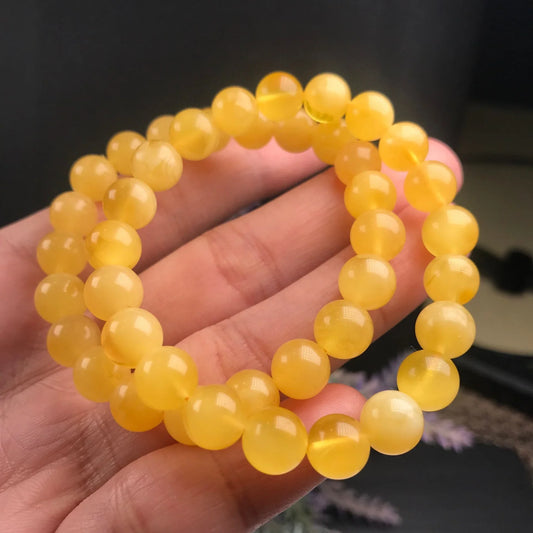 Handcrafted beeswax jewelry bracelet featuring a unique Kiwi design and natural charm