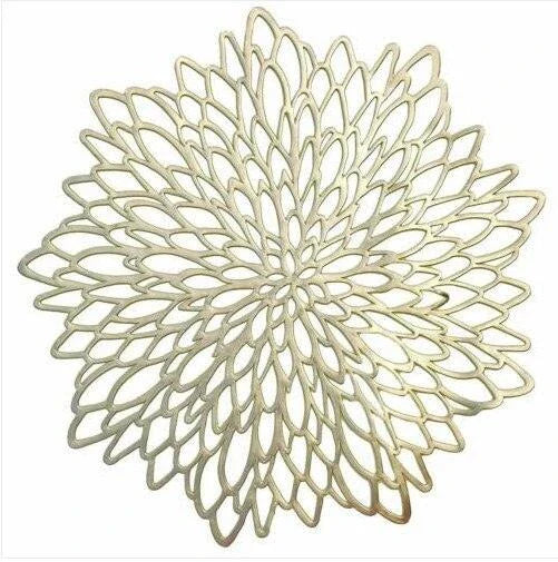 Flower-shaped PVC placemat in gold color, adding natural beauty and elegance to a dining table setting.