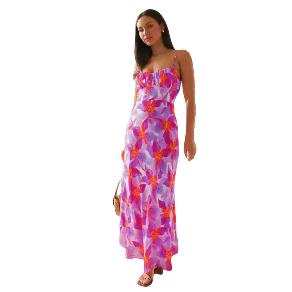 Stylish sleeveless backless midi dress with a vibrant floral print, perfect for any occasion