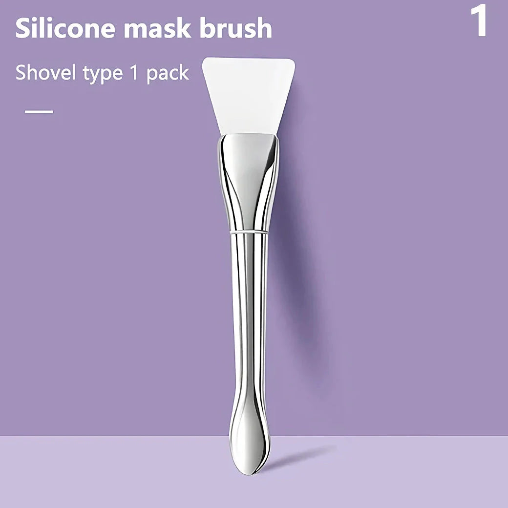A soft, flexible silicone makeup and mask brush with a durable plastic handle, perfect for precise, mess-free application of facial products.