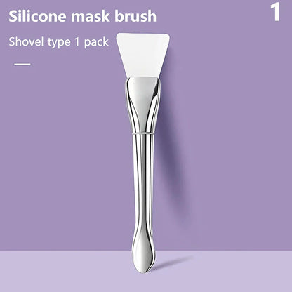 A soft, flexible silicone makeup and mask brush with a durable plastic handle, perfect for precise, mess-free application of facial products.