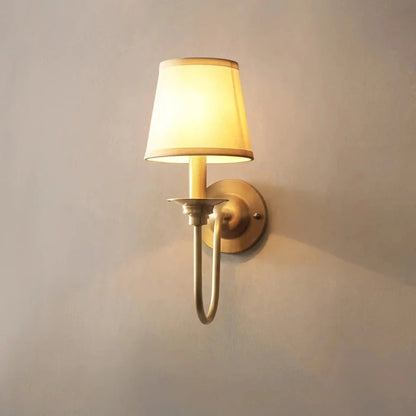 Elegant copper wall lamp with a luxurious fabric shade, providing warm and ambient lighting for Kiwi homes