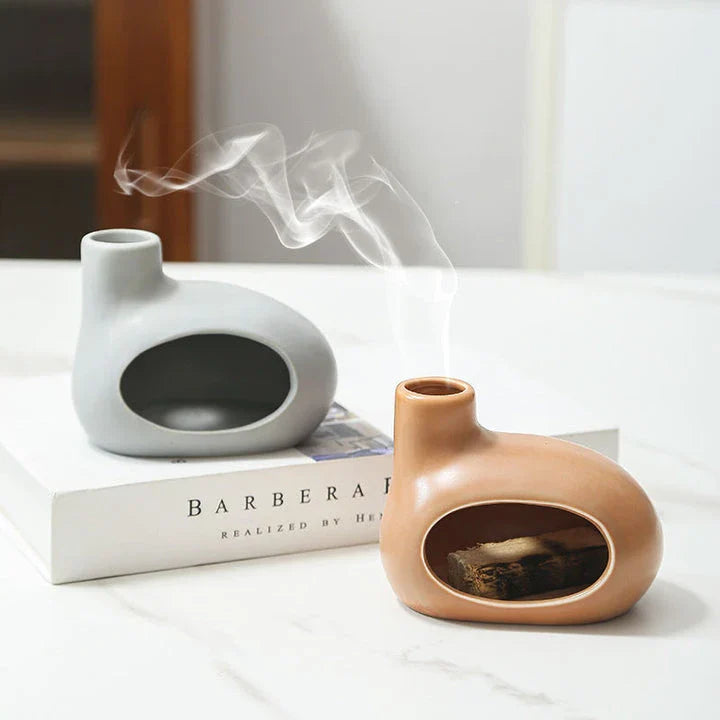 Elegant ceramic Palo Santo incense burner with modern, minimalist design in light brown, white, and gray color options