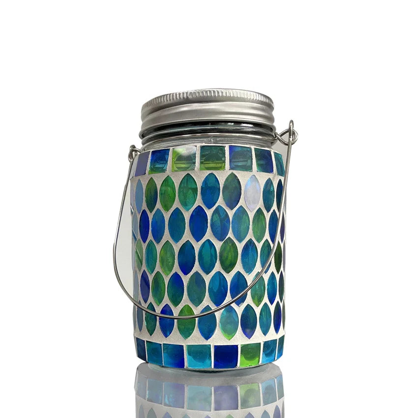 Handcrafted solar-powered outdoor mason jar lamp in a blue color, providing warm, ambient lighting for Kiwi backyard and patio