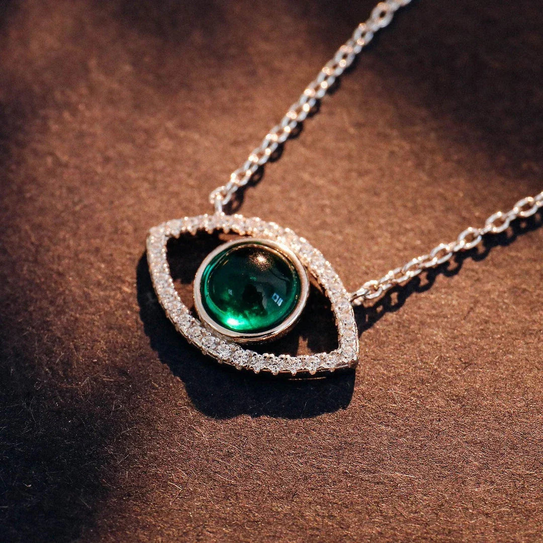 Elegant silver necklace with a captivating cultivated emerald stone, the perfect accessory for Kiwis to elevate their style.