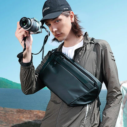 A grey one-shoulder crossbody chest bag with a zippered closure and dedicated pockets for the modern, active Kiwi man