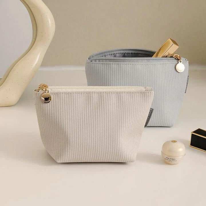 Compact and versatile mini cosmetic pouch in beige and gray colours, perfect for New Zealand travellers