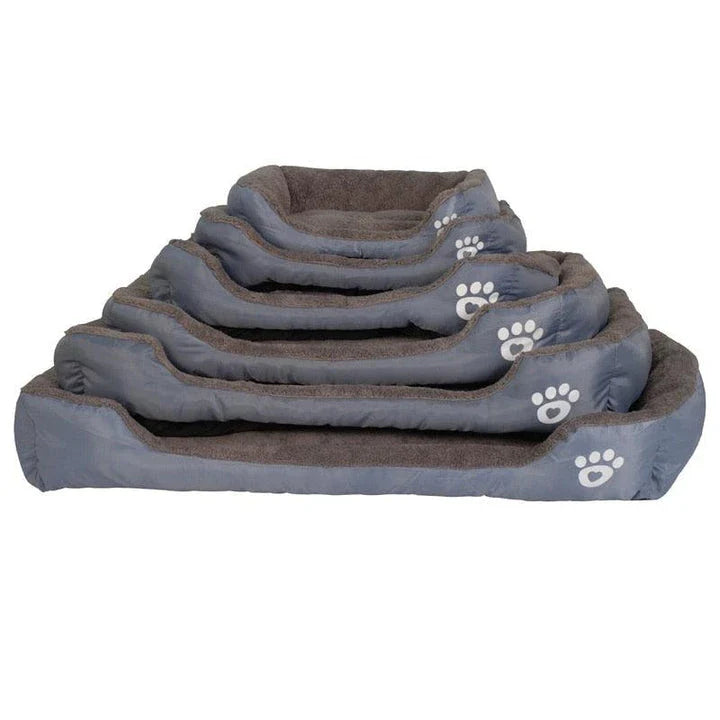 A cozy, waterproof pet bed featuring a soft fleece lining and paw print design, perfect for providing comfort and support for your beloved companion.