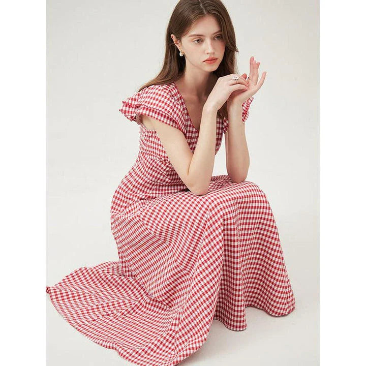 Elegant red plaid summer dress with flattering empire waistline and petal sleeves, perfect for Kiwi summer occasions