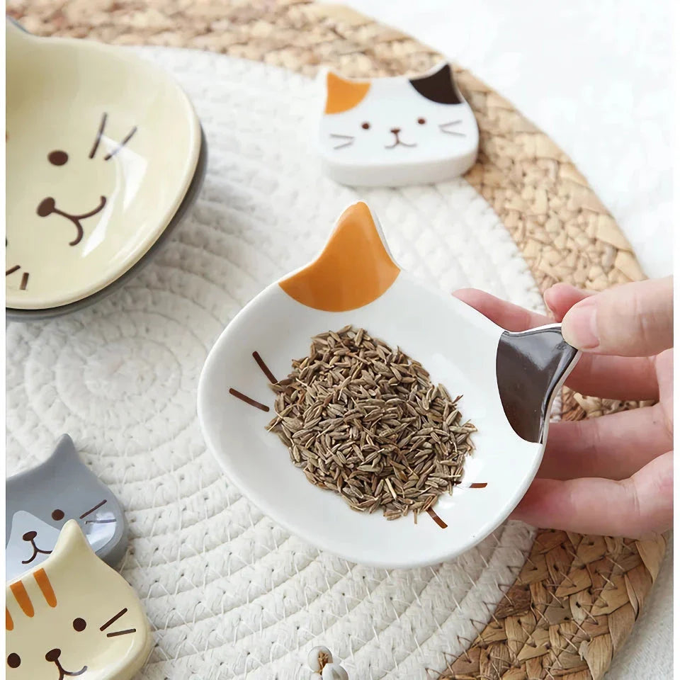 Charming Japanese-style ceramic condiment dish with a playful cat design, perfect for serving sauces, dips, and small snacks.