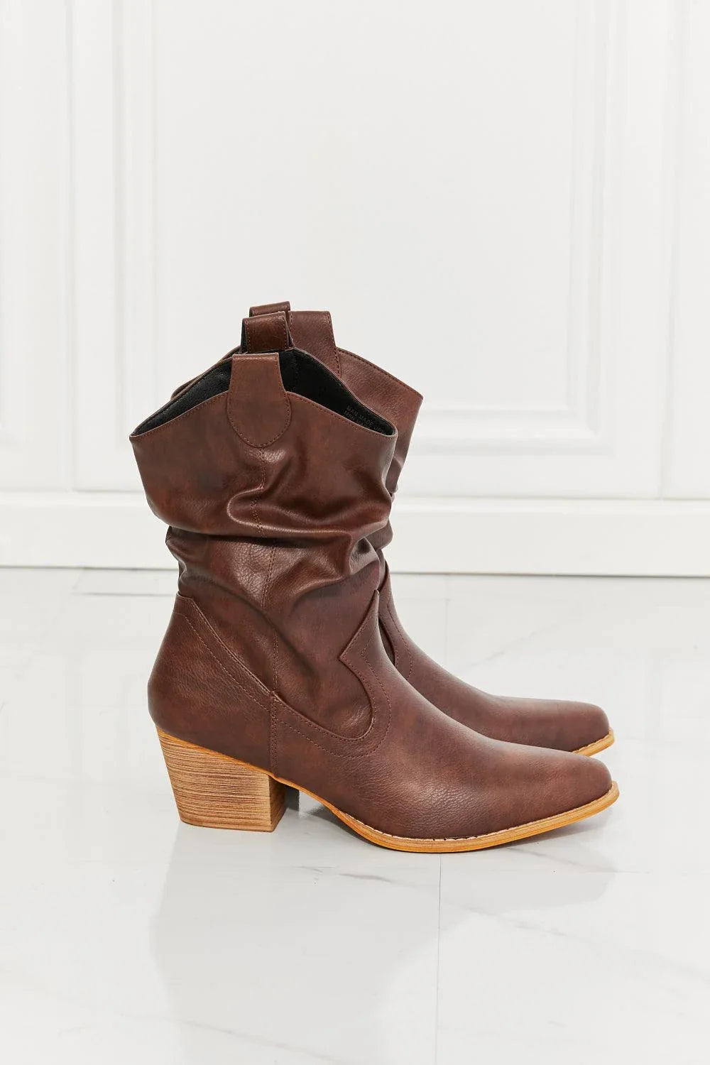 Stylish scrunch cowboy boots in a rich brown color, perfect for adding a touch of Texas flair to any Kiwi outfit.