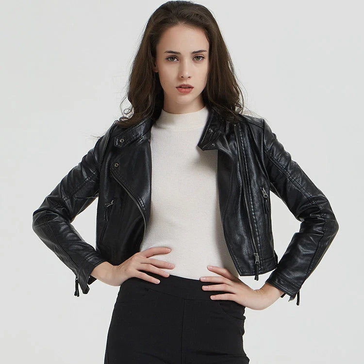 Trendha Women's Short Leather Jacket in Black, featuring a weathered finish and rivet detailing for a stylish, urban-inspired look